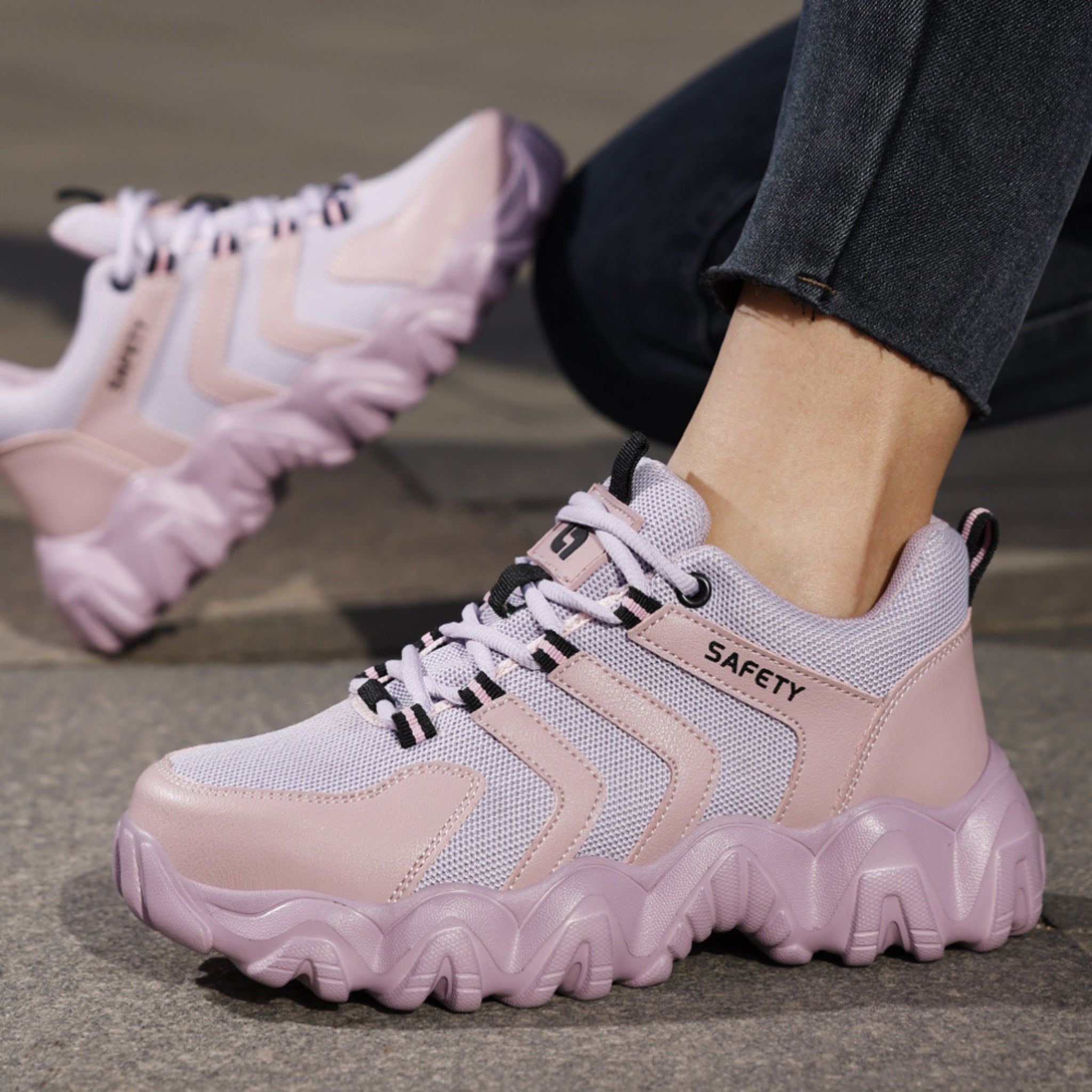 SafeStep CLOUD™ Lavender Mist safety sneakers on foot, showcasing the trendy chunky wave sole and pink-lavender aesthetic for a stylish work-to-street look.