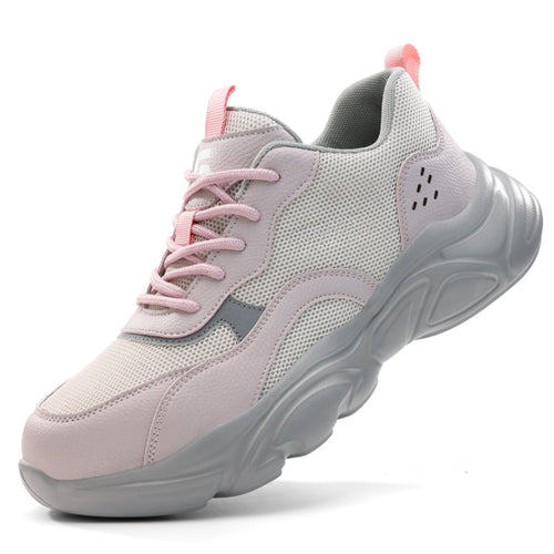 Side profile of SafeStep women's pink safety sneakers, featuring a breathable mesh upper, reinforced steel toe, and thick cushioned sole for athletic comfort.